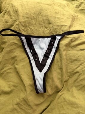 NWT age group intimate Light Blue Thong with Black Trim size L